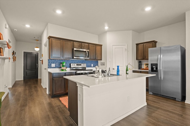 1417 Briar Hl, Denton, TX 76207 - kitchen featuring appliances with stainless steel finishes, a sink, dark wood-style floors, and recessed lighting