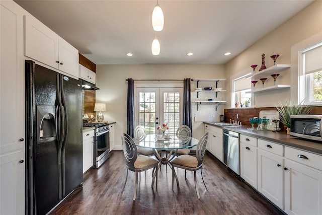 kitchen featuring under cabinet range hood, white cabinets, open shelves, and appliances with stainless steel finishes