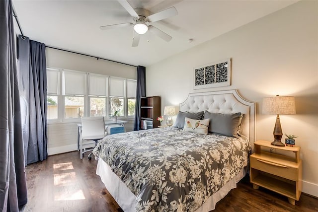 bedroom featuring a ceiling fan and dark wood finished floors