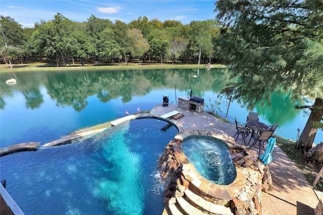 11588 Wild Rose Ln, Anna, TX 75409 - view of swimming pool with a water view, an in ground hot tub, and a forest view
