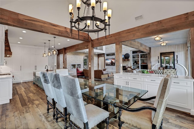11588 Wild Rose Ln, Anna, TX 75409 - dining area with recessed lighting, an inviting chandelier, beam ceiling, visible vents, and hardwood / wood-style flooring