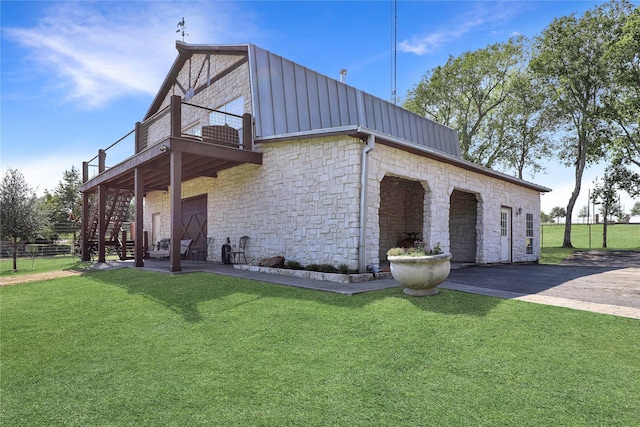 11588 Wild Rose Ln, Anna, TX 75409 - view of home's exterior with a patio, a yard, stone siding, and a balcony