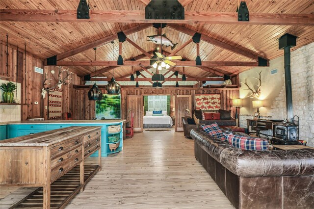 11588 Wild Rose Ln, Anna, TX 75409 - playroom featuring wood-type flooring, a wood stove, high vaulted ceiling, and beamed ceiling