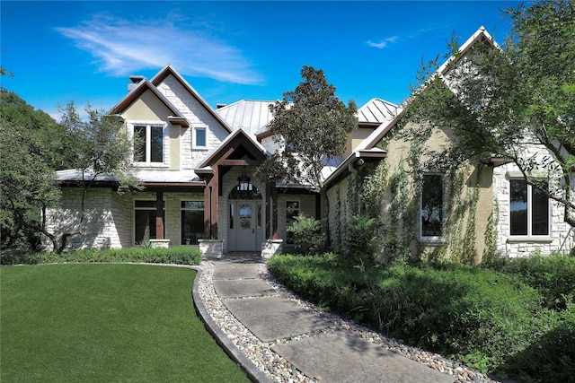 11588 Wild Rose Ln, Anna, TX 75409 - craftsman house featuring a standing seam roof, metal roof, a front yard, and stone siding