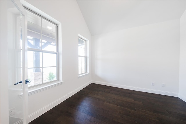 7306 Mallow Way, Venus, TX 76084 - spare room with dark wood-type flooring, baseboards, and vaulted ceiling