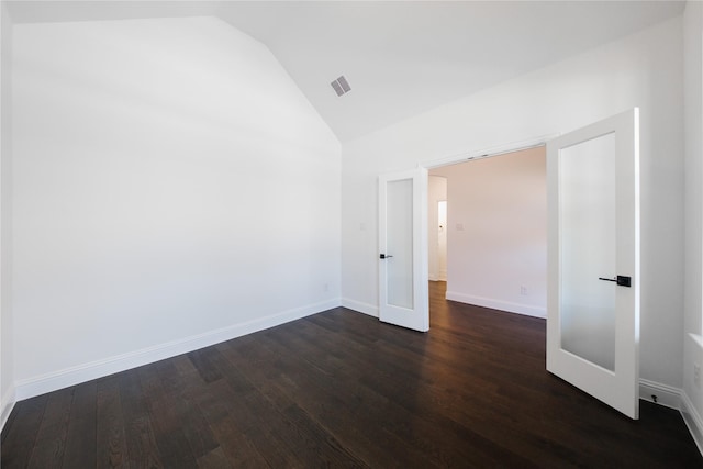 7306 Mallow Way, Venus, TX 76084 - spare room featuring vaulted ceiling, dark wood-type flooring, and baseboards