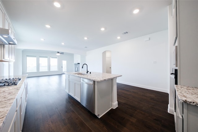 7306 Mallow Way, Venus, TX 76084 - kitchen featuring stainless steel appliances, a ceiling fan, dark wood-type flooring, arched walkways, and a sink