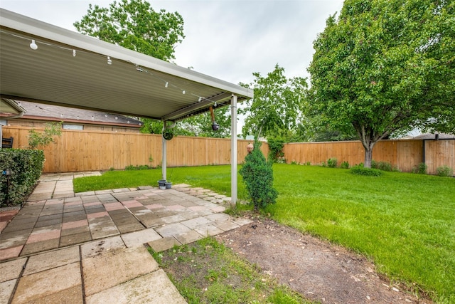 view of yard featuring a patio and a fenced backyard
