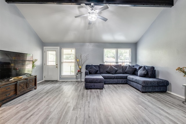 living area featuring baseboards, wood finished floors, ceiling fan, and vaulted ceiling