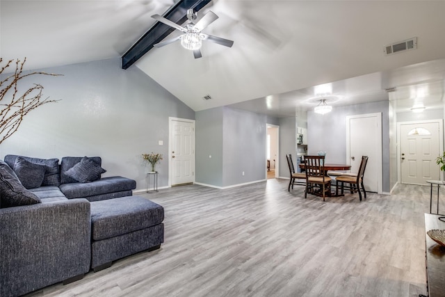 living room with visible vents, a ceiling fan, light wood finished floors, and baseboards
