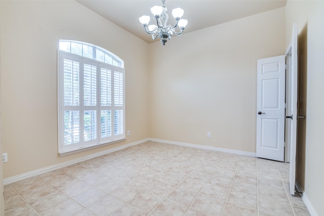 942 Lexington Dr, Rockwall, TX 75087 - spare room featuring light tile patterned floors, lofted ceiling, and a chandelier