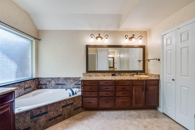 942 Lexington Dr, Rockwall, TX 75087 - full bath featuring a garden tub, vanity, tile patterned flooring, and vaulted ceiling