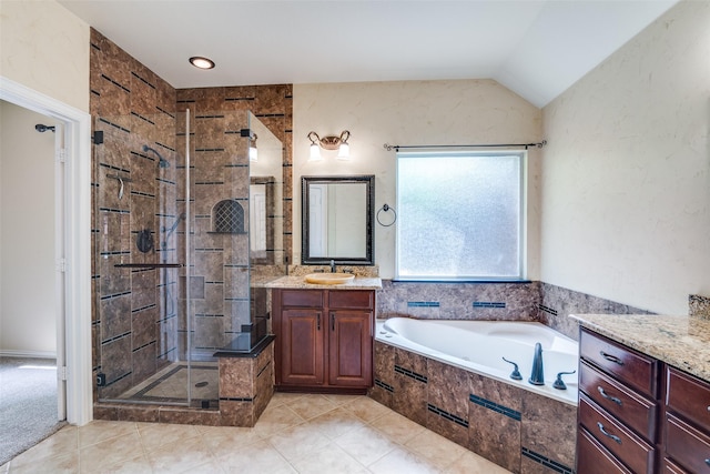 942 Lexington Dr, Rockwall, TX 75087 - full bathroom with a stall shower, a bath, vaulted ceiling, vanity, and tile patterned flooring