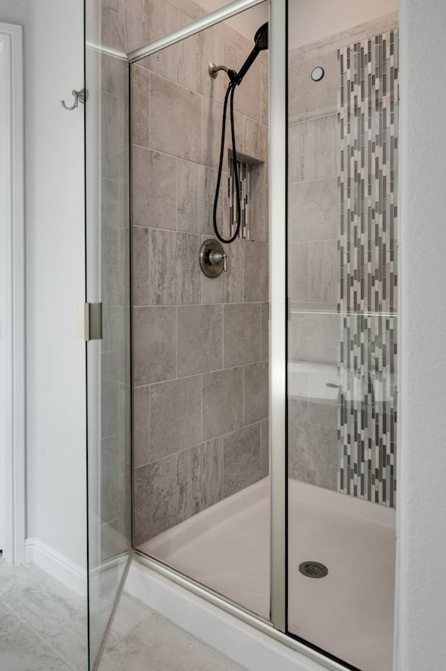 bathroom featuring a shower stall