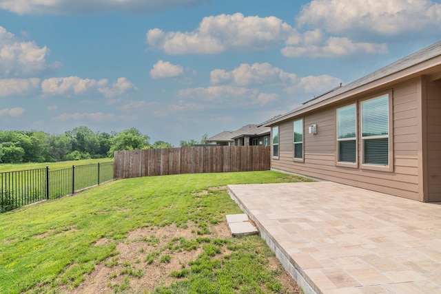 view of yard with a fenced backyard and a patio area