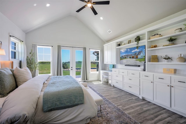 bedroom with a ceiling fan, access to exterior, visible vents, french doors, and wood finished floors