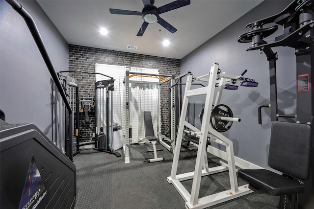 exercise room featuring visible vents, a ceiling fan, and carpet flooring