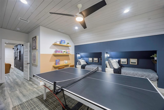 recreation room featuring visible vents, wooden ceiling, wood finished floors, and a ceiling fan