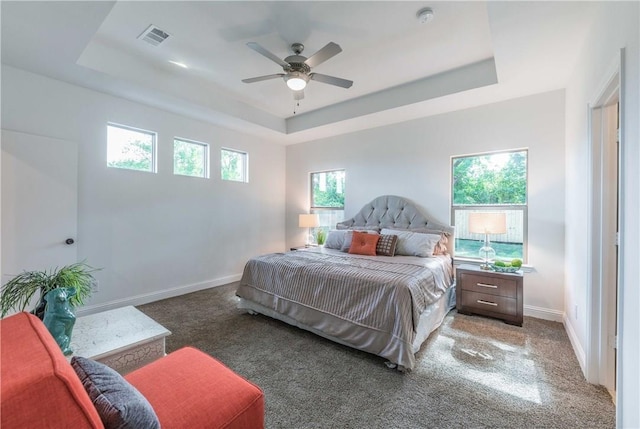10169 Budtime Ln, Dallas, TX 75217 - carpeted bedroom featuring a ceiling fan, baseboards, visible vents, and a raised ceiling