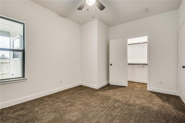 10169 Budtime Ln, Dallas, TX 75217 - unfurnished bedroom featuring carpet floors, baseboards, a closet, and a walk in closet