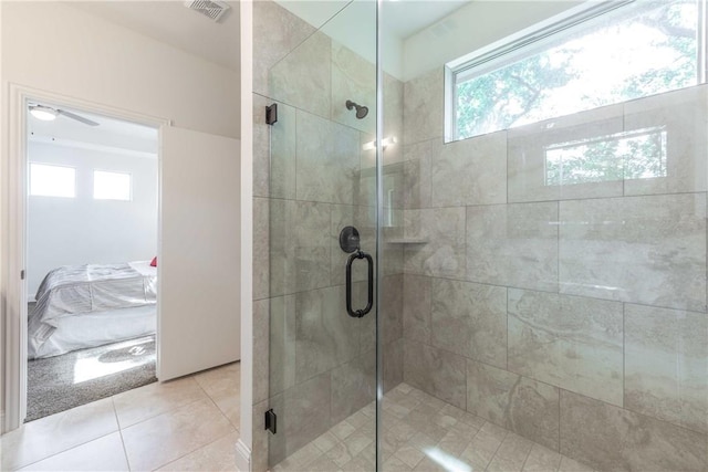 10169 Budtime Ln, Dallas, TX 75217 - bathroom with tile patterned floors, a ceiling fan, a stall shower, and visible vents