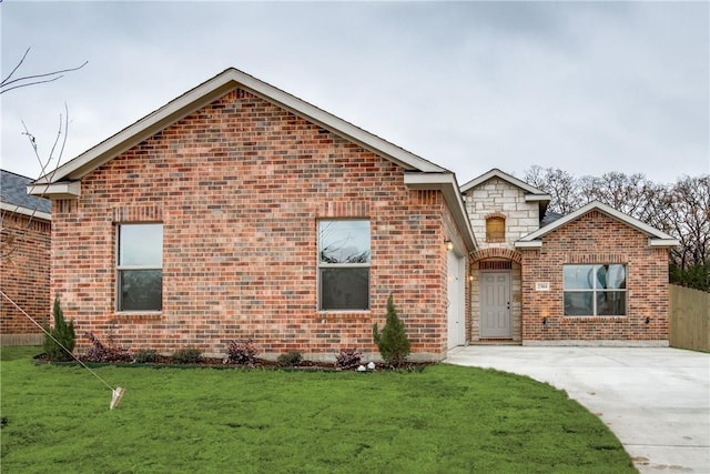 10169 Budtime Ln, Dallas, TX 75217 - ranch-style home featuring concrete driveway, brick siding, and a front lawn