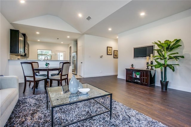 10169 Budtime Ln, Dallas, TX 75217 - living area featuring recessed lighting, baseboards, wood finished floors, vaulted ceiling, and visible vents
