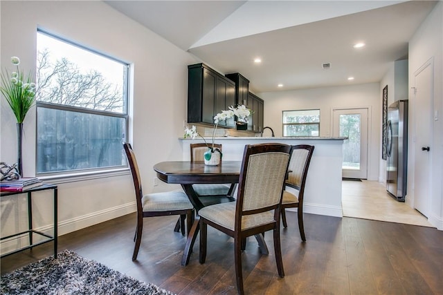 10169 Budtime Ln, Dallas, TX 75217 - dining area with baseboards, recessed lighting, and wood finished floors