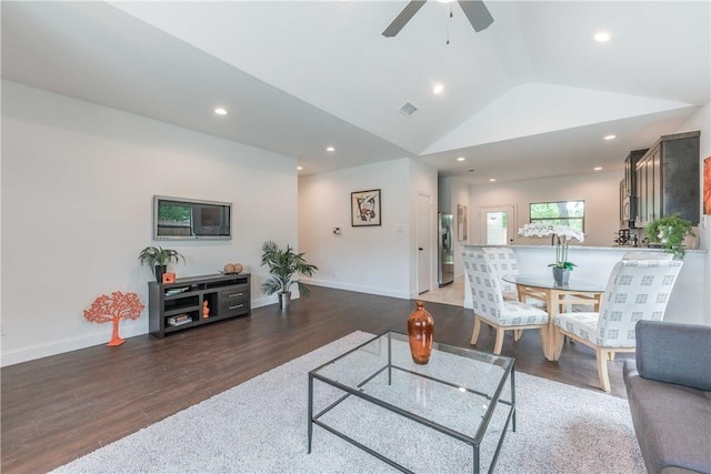 10169 Budtime Ln, Dallas, TX 75217 - living area with ceiling fan, baseboards, wood finished floors, lofted ceiling, and visible vents