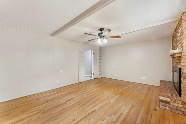unfurnished living room featuring light wood-type flooring, ceiling fan, and a fireplace