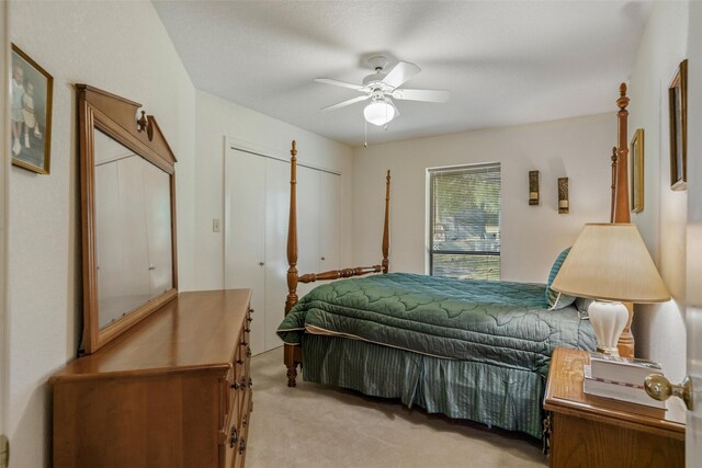 carpeted bedroom with a ceiling fan