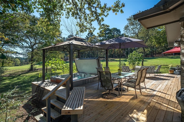 deck featuring a yard, outdoor dining space, a gazebo, and a hot tub