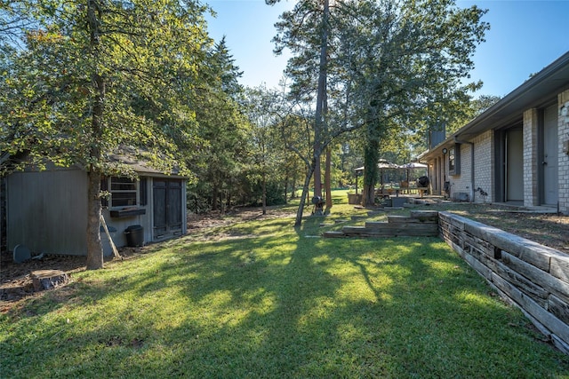 view of yard with an outdoor structure and a shed