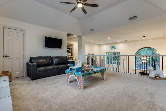 recreation room featuring visible vents, ceiling fan with notable chandelier, carpet floors, and a towering ceiling