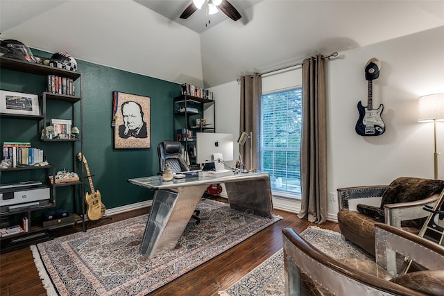 office space with lofted ceiling, wood finished floors, a ceiling fan, and baseboards