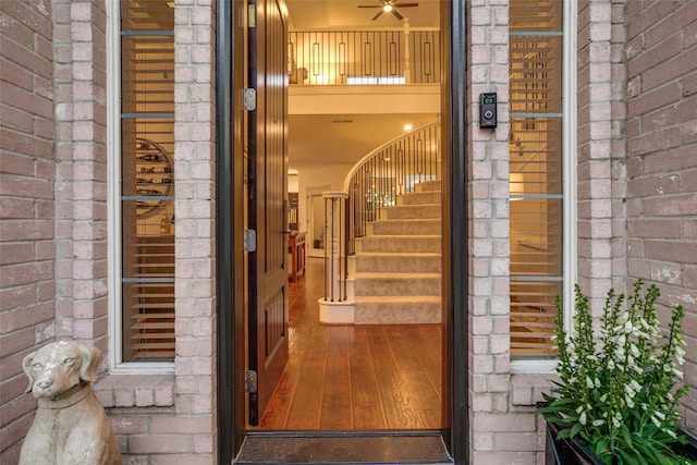 doorway to property with brick siding