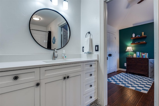full bath with wood finished floors and vanity