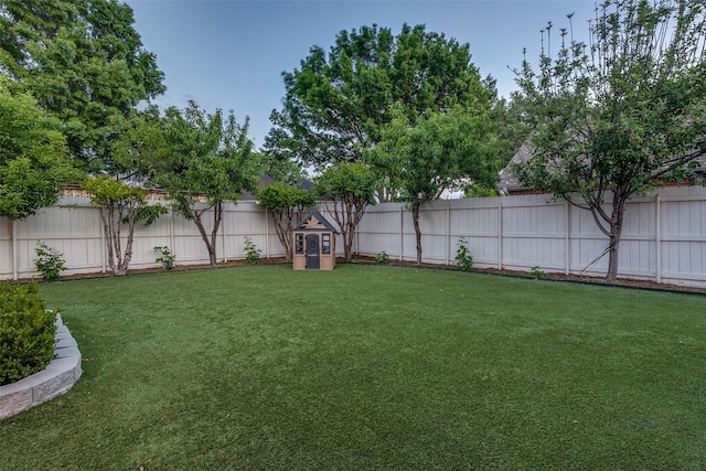 view of yard with a fenced backyard