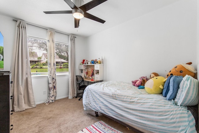 2409 Leslie St, Denton, TX 76205 - bedroom featuring baseboards, ceiling fan, and light carpet