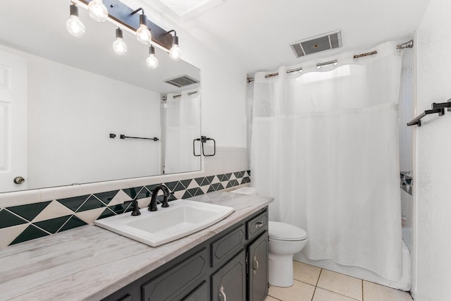 2409 Leslie St, Denton, TX 76205 - bathroom featuring vanity, toilet, tile patterned floors, and visible vents