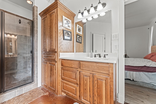ensuite bathroom with a shower stall, ensuite bathroom, and vanity