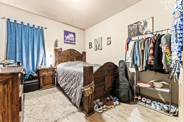 bedroom featuring wood finished floors