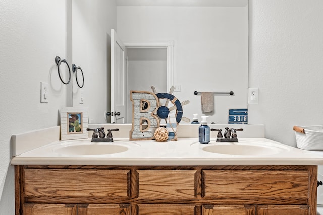 bathroom featuring double vanity and a sink
