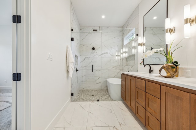 full bathroom featuring double vanity, a marble finish shower, recessed lighting, a freestanding tub, and marble finish floor