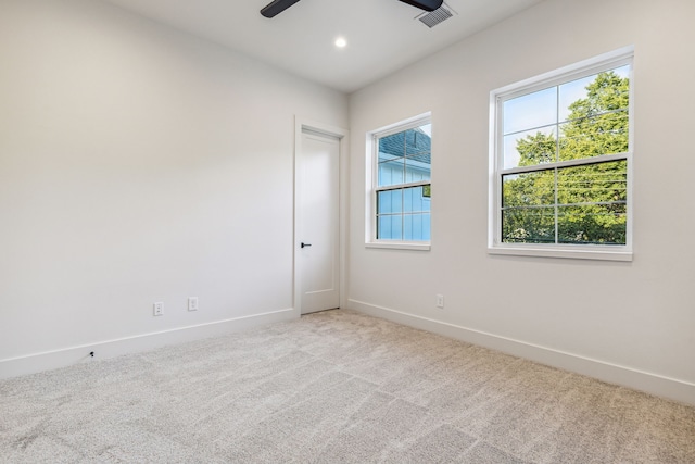 carpeted empty room with recessed lighting, visible vents, ceiling fan, and baseboards