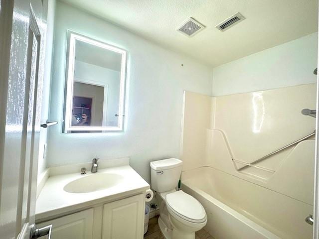 full bath with toilet, visible vents, washtub / shower combination, and vanity