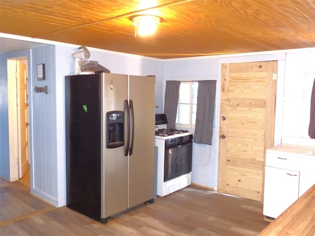 286 N Fm 1851, Voca, TX 76887 - kitchen featuring gas stove, stainless steel fridge, wood finished floors, and wood ceiling