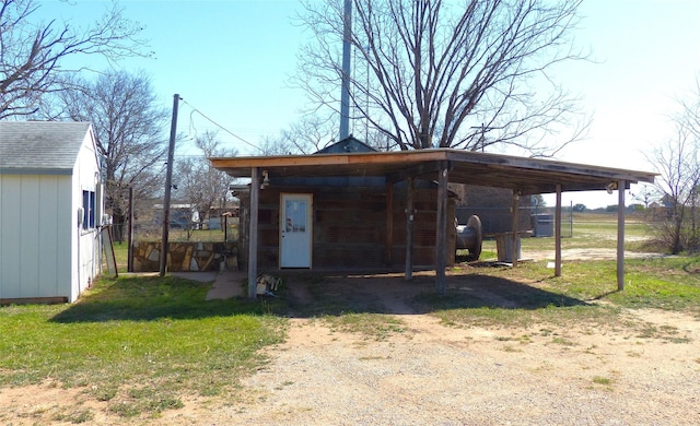 286 N Fm 1851, Voca, TX 76887 - view of outdoor structure featuring driveway and a carport