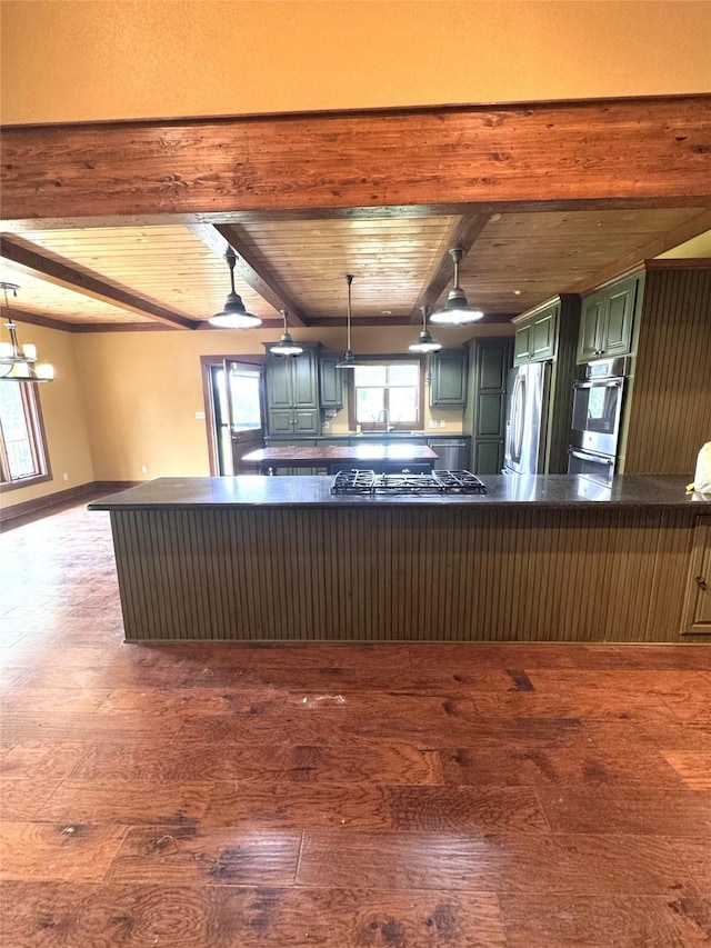 kitchen featuring dark countertops, stainless steel appliances, wooden ceiling, beamed ceiling, and hardwood / wood-style flooring