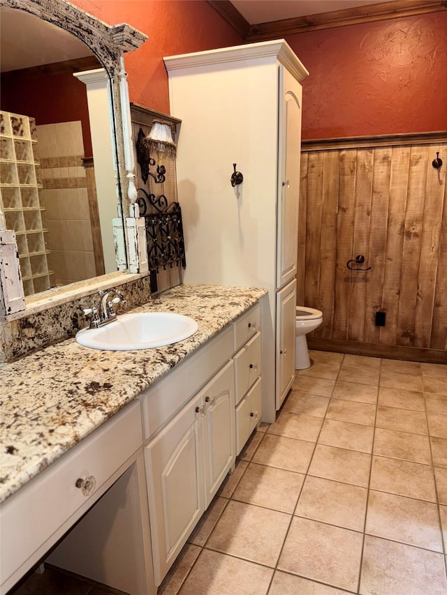 bathroom featuring toilet, tile patterned floors, and vanity